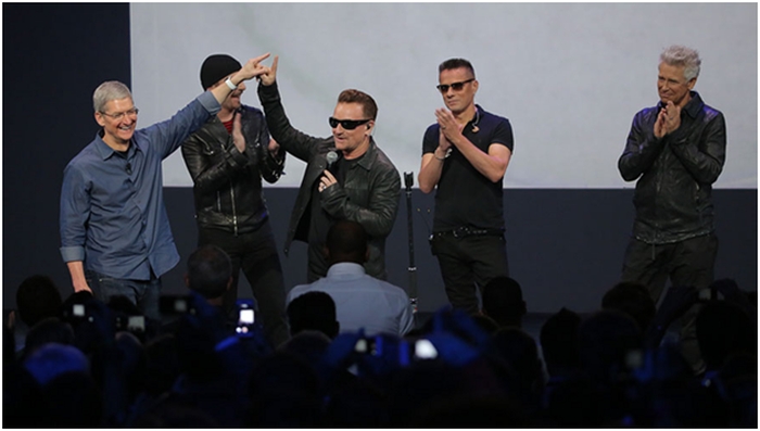 Tim Cook with Bono and the boys of U2