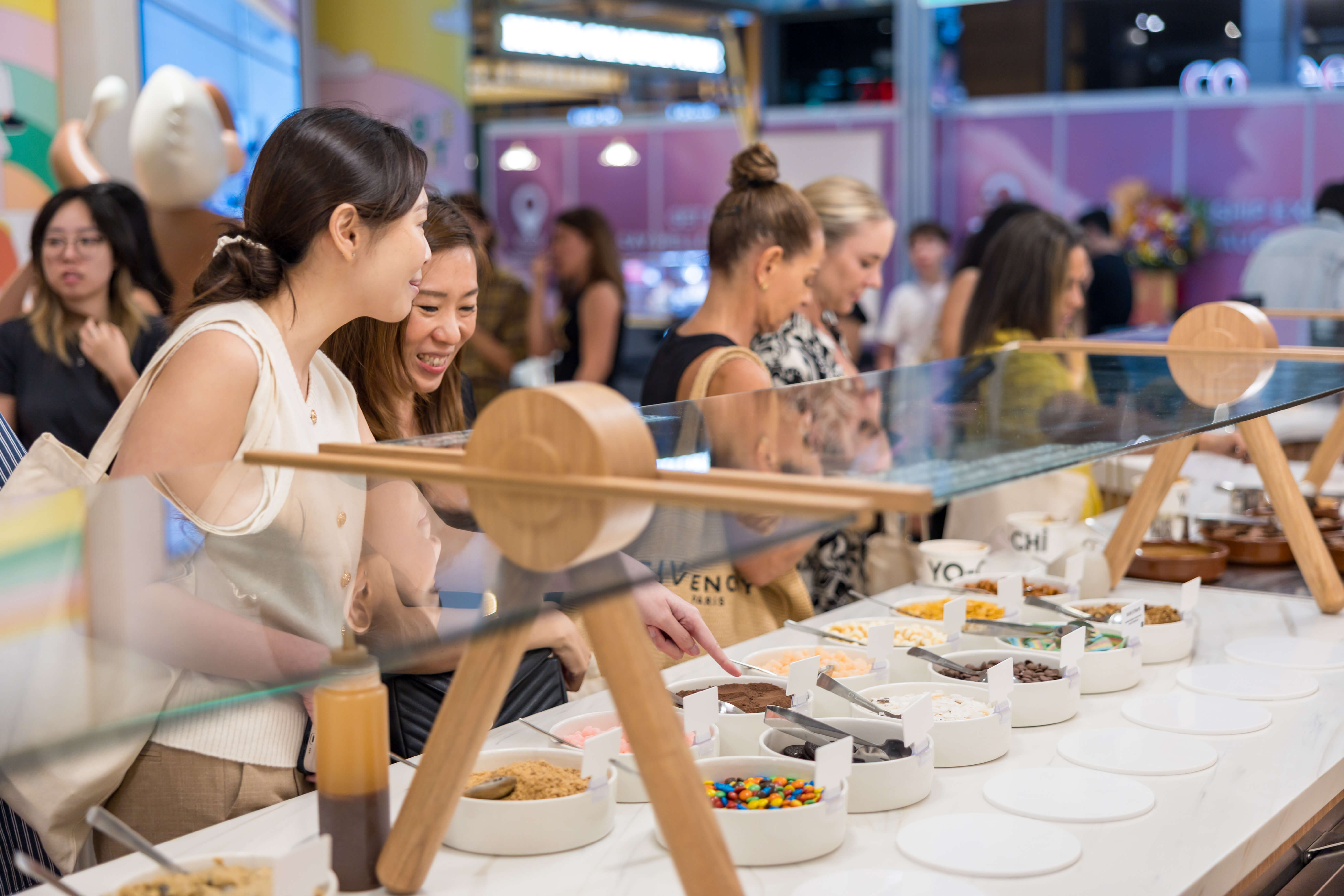 customers choosing their toppings at yo-chi singapore